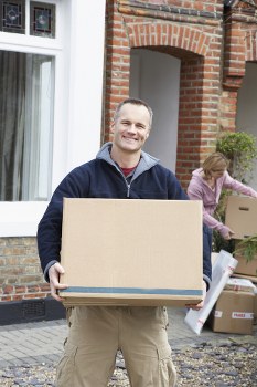 Moving boxes and furniture loaded into a van for a Pimlico flat relocation