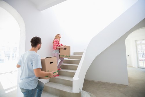 Unloading boxes into a Pimlico flat after a local removals service