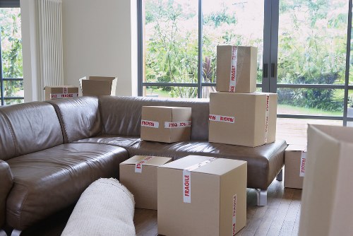Packed boxes and furniture prepared for transport by movers