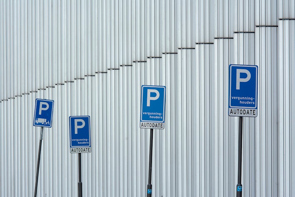Close-up of a weathered metal parking restriction sign mounted on a blue pole, with peeling paint and rust spots. The sign reads 'THIS SPACE RESERVED 24 HOURS' in white capital letters, with some parts of the text slightly faded. It is attached to a concrete wall that shows signs of wear, dirt, and peeling paint. The image captures a typical urban setting relevant to house removals and moving logistics, highlighting the importance of complying with parking rules during home relocation or furniture transport. The sign’s worn condition reflects the potential challenges of parking enforcement in busy areas like Pimlico, where local regulations may impact moving schedules. Pimlico Movers, a professional house removals company, often coordinate with clients to navigate such restrictions to facilitate smooth packing, loading, and transportation processes.
